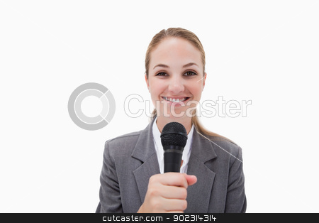 To use this stock image in your creative project, please select the size you need over to the right and click the "Add to Cart" button.
Your downloaded image will come with the Cutcaster watermark removed so don’t worry about the watermark you see on this page. Smiling woman with microphone stock photo, Smiling woman with microphone against a white background by Wavebreak Media