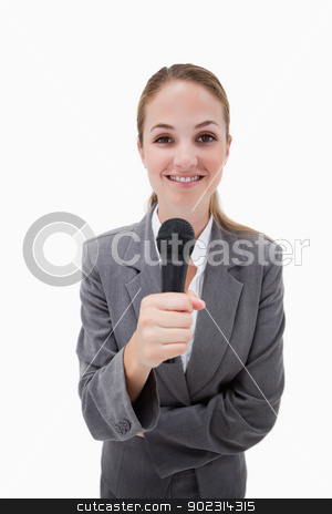 To use this stock image in your creative project, please select the size you need over to the right and click the "Add to Cart" button.
Your downloaded image will come with the Cutcaster watermark removed so don’t worry about the watermark you see on this page. Smiling woman holding microphone stock photo, Smiling woman holding microphone against a white background by Wavebreak Media