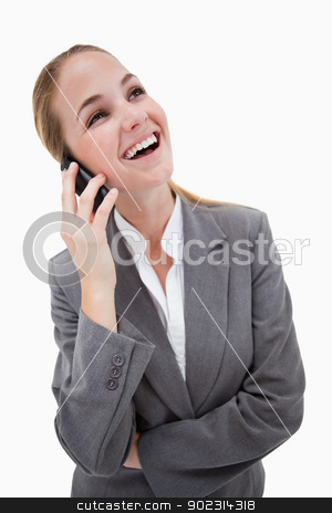 To use this stock image in your creative project, please select the size you need over to the right and click the "Add to Cart" button.
Your downloaded image will come with the Cutcaster watermark removed so don’t worry about the watermark you see on this page. Laughing bank employee on her cellphone stock photo, Laughing bank employee on her cellphone against a white background by Wavebreak Media