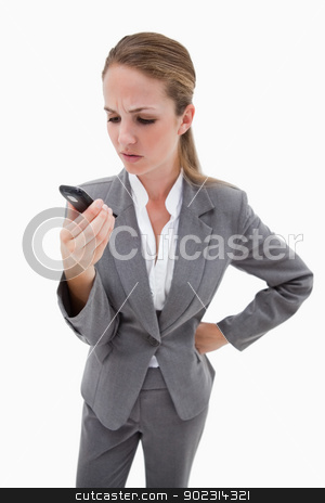To use this stock image in your creative project, please select the size you need over to the right and click the "Add to Cart" button.
Your downloaded image will come with the Cutcaster watermark removed so don’t worry about the watermark you see on this page. Irritated bank employee reading text message stock photo, Irritated bank employee reading text message against a white background by Wavebreak Media