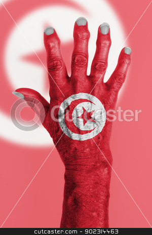 To use this stock image in your creative project, please select the size you need over to the right and click the "Add to Cart" button.
Your downloaded image will come with the Cutcaster watermark removed so don’t worry about the watermark you see on this page. Hand of an old woman wrapped in flag stock photo, Hand of an old woman wrapped in flag of Tunisia by michaklootwijk