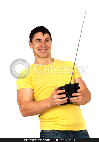 To use this stock image in your creative project, please select the size you need over to the right and click the "Add to Cart" button.
Your downloaded image will come with the Cutcaster watermark removed so don’t worry about the watermark you see on this page. Man with radio remote control stock photo, Young athletic man holding a radio remote control (controlling handset) for helicopter or plane.Isolated on white background by borojoint