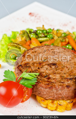 To use this stock image in your creative project, please select the size you need over to the right and click the "Add to Cart" button.
Your downloaded image will come with the Cutcaster watermark removed so don’t worry about the watermark you see on this page. Beef steak meat stock photo, Beef steak meat with vegetables and sauce by olinchuk