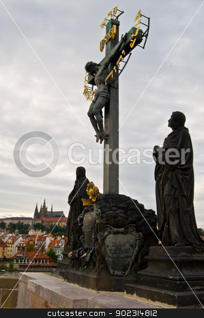 To use this stock image in your creative project, please select the size you need over to the right and click the "Add to Cart" button.
Your downloaded image will come with the Cutcaster watermark removed so don’t worry about the watermark you see on this page. Statue at the Charles bridge stock photo, statue of Jesus on the cross at the Charles Bridge by Juliane Jacobs