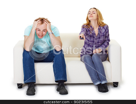 To use this stock image in your creative project, please select the size you need over to the right and click the "Add to Cart" button.
Your downloaded image will come with the Cutcaster watermark removed so don’t worry about the watermark you see on this page. Nervous husband and wife sitting on couch watching TV stock photo, Nervous husband and wife sitting on the couch watching TV isolated on white background by Alexey Romanov