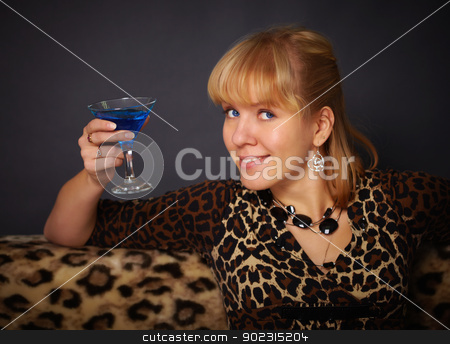 To use this stock image in your creative project, please select the size you need over to the right and click the "Add to Cart" button.
Your downloaded image will come with the Cutcaster watermark removed so don’t worry about the watermark you see on this page. Beautiful young woman drinking blue cocktail stock photo, Beautiful young woman drinking blue cocktail on black background by Alexey Romanov