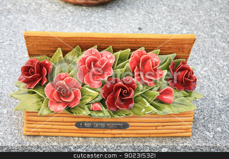 To use this stock image in your creative project, please select the size you need over to the right and click the "Add to Cart" button.
Your downloaded image will come with the Cutcaster watermark removed so don’t worry about the watermark you see on this page. Ceramic sympathy flowers stock photo, Ceramic sympathy flowers at a French graveyard by Porto Sabbia