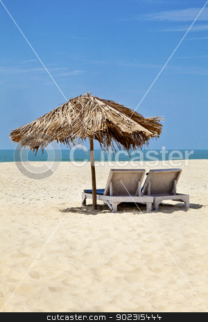To use this stock image in your creative project, please select the size you need over to the right and click the "Add to Cart" button.
Your downloaded image will come with the Cutcaster watermark removed so don’t worry about the watermark you see on this page. Vertical landscape sea sand beach loungers stock photo, A generic vertical portrait of a tropical deserted beach with loungers under a coconut leaf parasol. Blue sky, ocean, gentle surf sound and clean sandy beach. Location, Goa India by Kantilal Patel
