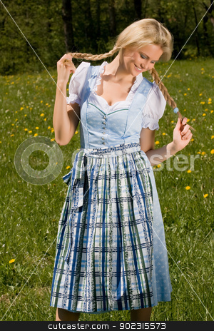 To use this stock image in your creative project, please select the size you need over to the right and click the "Add to Cart" button.
Your downloaded image will come with the Cutcaster watermark removed so don’t worry about the watermark you see on this page. happy girl stock photo, Bavarian girl costume is laughing on the grass by Roland Stollner
