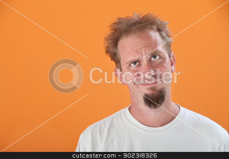 To use this stock image in your creative project, please select the size you need over to the right and click the "Add to Cart" button.
Your downloaded image will come with the Cutcaster watermark removed so don’t worry about the watermark you see on this page. Messy and Annoyed Man stock photo, Annoyed Caucasian man looking up on an orange background by Scott Griessel