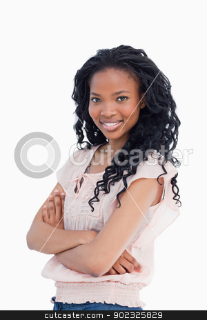 To use this stock image in your creative project, please select the size you need over to the right and click the "Add to Cart" button.
Your downloaded image will come with the Cutcaster watermark removed so don’t worry about the watermark you see on this page. A young woman looking towards the camera with her arms folded stock photo, A young woman is looking towards the camera with her arms folded against a white background by Wavebreak Media