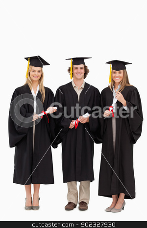 To use this stock image in your creative project, please select the size you need over to the right and click the "Add to Cart" button.
Your downloaded image will come with the Cutcaster watermark removed so don’t worry about the watermark you see on this page. Three students in graduate robe holding a diploma stock photo, Three students in graduate robe holding a diploma against white background by Wavebreak Media