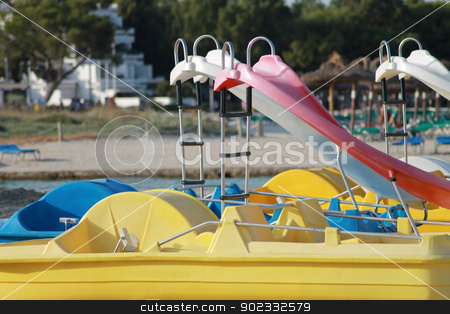 To use this stock image in your creative project, please select the size you need over to the right and click the "Add to Cart" button.
Your downloaded image will come with the Cutcaster watermark removed so don’t worry about the watermark you see on this page. Slides on pedalo boats stock photo, Slides on pedalo boats with beach in background. by Martin Crowdy