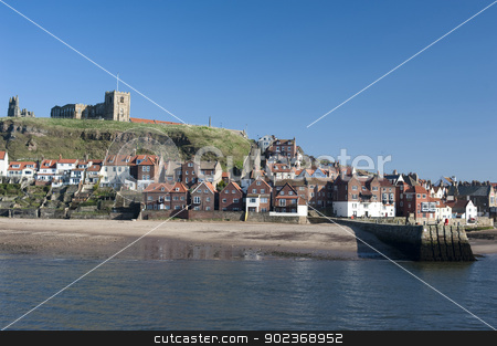 To use this stock image in your creative project, please select the size you need over to the right and click the "Add to Cart" button.
Your downloaded image will come with the Cutcaster watermark removed so don’t worry about the watermark you see on this page. Whitby in North Yorkshire stock photo, View of the waterfront and houses in Whitby in North Yorkshire with Tate hill in the background by Stephen Gibson