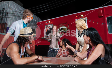 To use this stock image in your creative project, please select the size you need over to the right and click the "Add to Cart" button.
Your downloaded image will come with the Cutcaster watermark removed so don’t worry about the watermark you see on this page. Pizza Orders at Food Truck stock photo, Cheerful waitress bringing orders to people at pizza truck by Scott Griessel