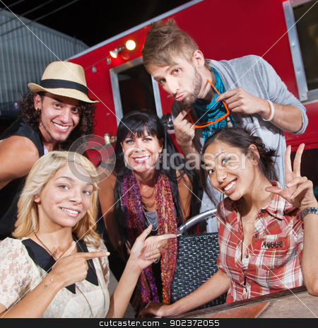 To use this stock image in your creative project, please select the size you need over to the right and click the "Add to Cart" button.
Your downloaded image will come with the Cutcaster watermark removed so don’t worry about the watermark you see on this page. Cute Group at Food Truck stock photo, Cute men and women sitting in front of food truck by Scott Griessel