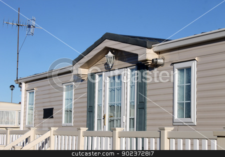 To use this stock image in your creative project, please select the size you need over to the right and click the "Add to Cart" button.
Your downloaded image will come with the Cutcaster watermark removed so don’t worry about the watermark you see on this page. Luxurious modern caravan stock photo, Exterior of luxurious modern caravan with blue sky background. by Martin Crowdy