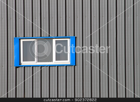 To use this stock image in your creative project, please select the size you need over to the right and click the "Add to Cart" button.
Your downloaded image will come with the Cutcaster watermark removed so don’t worry about the watermark you see on this page. Modern industrial building stock photo, Blue window on modern industrial building with gray corrugated iron. by Martin Crowdy