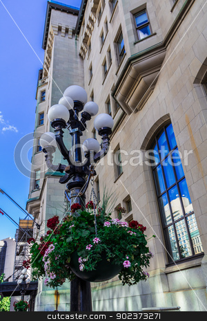 To use this stock image in your creative project, please select the size you need over to the right and click the "Add to Cart" button.
Your downloaded image will come with the Cutcaster watermark removed so don’t worry about the watermark you see on this page. Flowers on a lamp stock photo, Flowers on a lamp in a street in Ottawa, Ontario, Canada by Peter Kolomatski