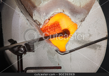To use this stock image in your creative project, please select the size you need over to the right and click the "Add to Cart" button.
Your downloaded image will come with the Cutcaster watermark removed so don’t worry about the watermark you see on this page. Glass Baking in Kiln stock photo, Glass object held by rod baking in hot kiln by Scott Griessel