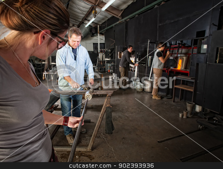 To use this stock image in your creative project, please select the size you need over to the right and click the "Add to Cart" button.
Your downloaded image will come with the Cutcaster watermark removed so don’t worry about the watermark you see on this page. Workers Making Glass Objects stock photo, Four men and women busy in a glass making workshop by Scott Griessel