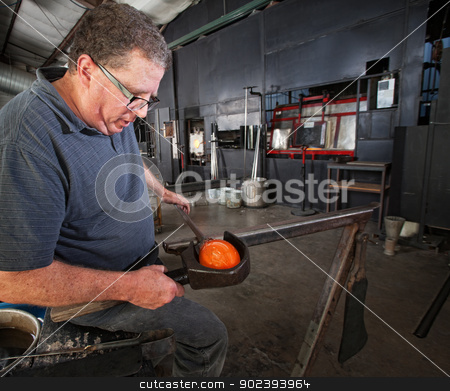 To use this stock image in your creative project, please select the size you need over to the right and click the "Add to Cart" button.
Your downloaded image will come with the Cutcaster watermark removed so don’t worry about the watermark you see on this page. Glass Worker Clamping Glass stock photo, Middle aged glass worker clamping a round vase by Scott Griessel