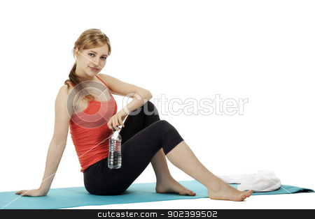 To use this stock image in your creative project, please select the size you need over to the right and click the "Add to Cart" button.
Your downloaded image will come with the Cutcaster watermark removed so don’t worry about the watermark you see on this page. young fitness woman with a bottle of water sitting on a mat making a break on white background stock photo, young fitness woman with a bottle of water sitting on a mat making a break on white background by Rob Stark