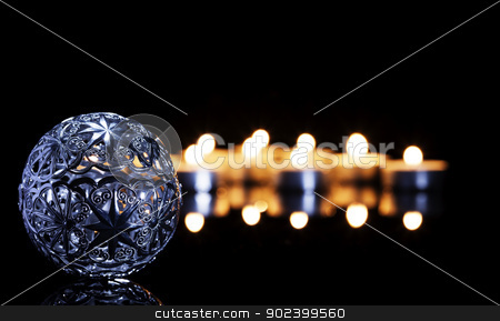 To use this stock image in your creative project, please select the size you need over to the right and click the "Add to Cart" button.
Your downloaded image will come with the Cutcaster watermark removed so don’t worry about the watermark you see on this page. metal christmas ball in front of tea candles on a black mirror stock photo, metal christmas ball in front of tea candles on a black mirror by Rob Stark