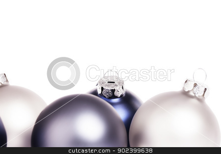 To use this stock image in your creative project, please select the size you need over to the right and click the "Add to Cart" button.
Your downloaded image will come with the Cutcaster watermark removed so don’t worry about the watermark you see on this page. closeup of some blue and silver christmas balls on white background stock photo, closeup of some blue and silver christmas balls on white background by Rob Stark
