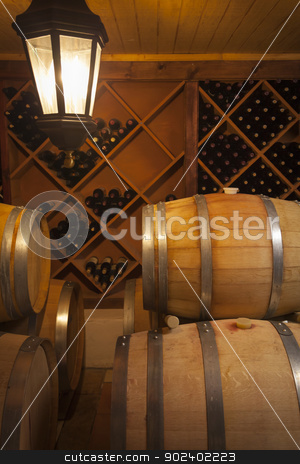 To use this stock image in your creative project, please select the size you need over to the right and click the "Add to Cart" button.
Your downloaded image will come with the Cutcaster watermark removed so don’t worry about the watermark you see on this page. Wine Barrels and Bottles in Cellar stock photo, Wine Barrels and Bottles in Dimly Lit Cellar. by Andy Dean