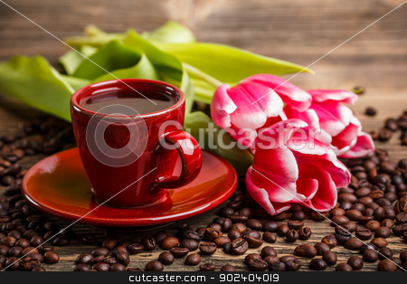 To use this stock image in your creative project, please select the size you need over to the right and click the "Add to Cart" button.
Your downloaded image will come with the Cutcaster watermark removed so don’t worry about the watermark you see on this page. Coffee cup stock photo, Coffee cup and red tulips by Grafvision