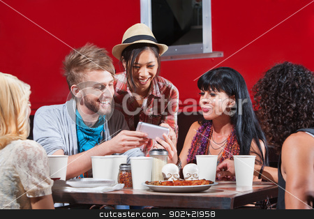 To use this stock image in your creative project, please select the size you need over to the right and click the "Add to Cart" button.
Your downloaded image will come with the Cutcaster watermark removed so don’t worry about the watermark you see on this page. Diverse Group Eating and Texting stock photo, Group of diverse people laughing with phone and eating pizza by Scott Griessel
