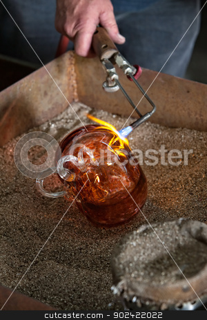 To use this stock image in your creative project, please select the size you need over to the right and click the "Add to Cart" button.
Your downloaded image will come with the Cutcaster watermark removed so don’t worry about the watermark you see on this page. Finishing Glass Art with Blowtorch stock photo, Blowtorch finishing fine art glass object in frit by Scott Griessel