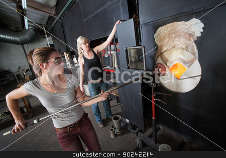 To use this stock image in your creative project, please select the size you need over to the right and click the "Add to Cart" button.
Your downloaded image will come with the Cutcaster watermark removed so don’t worry about the watermark you see on this page. Working at a Blast Furnace stock photo, Two female glass artists working at a blast furnace by Scott Griessel