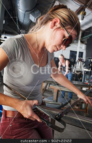 To use this stock image in your creative project, please select the size you need over to the right and click the "Add to Cart" button.
Your downloaded image will come with the Cutcaster watermark removed so don’t worry about the watermark you see on this page. Sculptor Shaping Glass Art stock photo, Pretty glass sculptor shaping tiny object on workbench by Scott Griessel