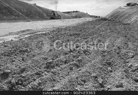 To use this stock image in your creative project, please select the size you need over to the right and click the "Add to Cart" button.
Your downloaded image will come with the Cutcaster watermark removed so don’t worry about the watermark you see on this page. Excavator unloading sand stock photo, Excavator unloading sand at eathmoving works in construction site black and white by ABBPhoto
