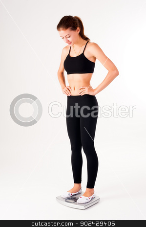 To use this stock image in your creative project, please select the size you need over to the right and click the "Add to Cart" button.
Your downloaded image will come with the Cutcaster watermark removed so don’t worry about the watermark you see on this page. happy young woman on weight scales stock photo, portrait of pretty caucasian woman on a scale who has lost weight and is fit and healthy by Aikon