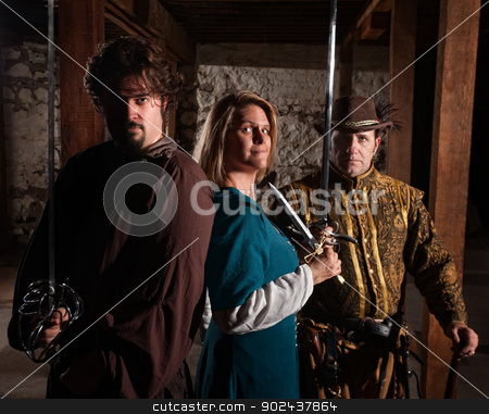 To use this stock image in your creative project, please select the size you need over to the right and click the "Add to Cart" button.
Your downloaded image will come with the Cutcaster watermark removed so don’t worry about the watermark you see on this page. Brave Trio of Swordfighters stock photo, Trio of brave European medieval characters by Scott Griessel