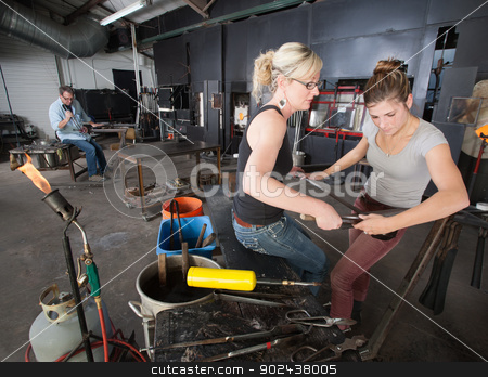 To use this stock image in your creative project, please select the size you need over to the right and click the "Add to Cart" button.
Your downloaded image will come with the Cutcaster watermark removed so don’t worry about the watermark you see on this page. Pair of Artisans Working with Tools stock photo, Pair of artisans working with tools in glass art workshop by Scott Griessel