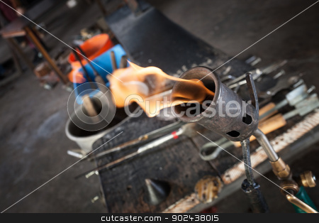 To use this stock image in your creative project, please select the size you need over to the right and click the "Add to Cart" button.
Your downloaded image will come with the Cutcaster watermark removed so don’t worry about the watermark you see on this page. Blowtorch Close Up stock photo, Close up of blowtorch and glass making tools by Scott Griessel