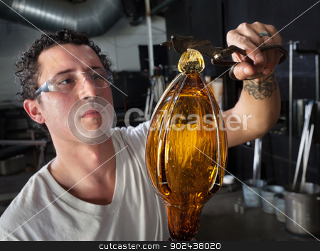 To use this stock image in your creative project, please select the size you need over to the right and click the "Add to Cart" button.
Your downloaded image will come with the Cutcaster watermark removed so don’t worry about the watermark you see on this page. European Glass Art Student Working stock photo, Handsome European glass art student finishing vase by Scott Griessel