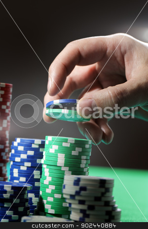 To use this stock image in your creative project, please select the size you need over to the right and click the "Add to Cart" button.
Your downloaded image will come with the Cutcaster watermark removed so don’t worry about the watermark you see on this page. Gambling stock photo, Man lifting two gambling chips from stacks with his hand. by Stocksnapper
