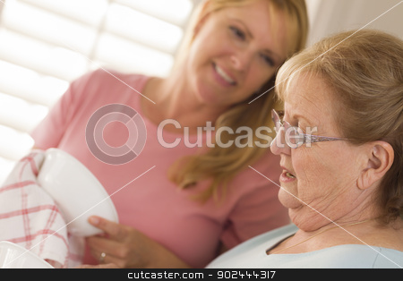 To use this stock image in your creative project, please select the size you need over to the right and click the "Add to Cart" button.
Your downloaded image will come with the Cutcaster watermark removed so don’t worry about the watermark you see on this page. Senior Adult Woman and Young Daughter Talking in Kitchen stock photo, Smiling Senior Adult Woman and Young Daughter Talking At Sink in Kitchen. by Andy Dean