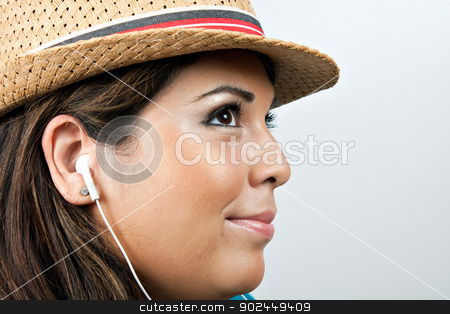 To use this stock image in your creative project, please select the size you need over to the right and click the "Add to Cart" button.
Your downloaded image will come with the Cutcaster watermark removed so don’t worry about the watermark you see on this page. Woman Wearing Earbud Headphones stock photo, An attractive Hispanic woman listening to music playing through her stereo earbud headphones. by Todd Arena