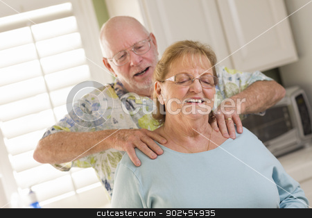 To use this stock image in your creative project, please select the size you need over to the right and click the "Add to Cart" button.
Your downloaded image will come with the Cutcaster watermark removed so don’t worry about the watermark you see on this page. Senior Adult Husband Giving Wife a Shoulder Rub stock photo, Happy Senior Adult Husband Giving Wife a Shoulder Rub in the Kitchen. by Andy Dean