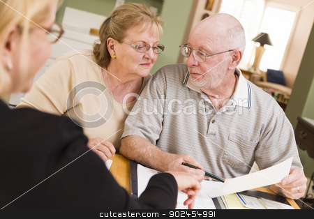 To use this stock image in your creative project, please select the size you need over to the right and click the "Add to Cart" button.
Your downloaded image will come with the Cutcaster watermark removed so don’t worry about the watermark you see on this page. Senior Adult Couple Going Over Papers in Their Home with Agent stock photo, Senior Adult Couple Going Over Papers in Their Home with Agent. by Andy Dean