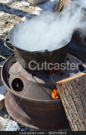 To use this stock image in your creative project, please select the size you need over to the right and click the "Add to Cart" button.
Your downloaded image will come with the Cutcaster watermark removed so don’t worry about the watermark you see on this page. Preparing Maple Syrup stock photo, The process of boiling maple sap to create maple syrup, using a traditional method. by Maria Bell