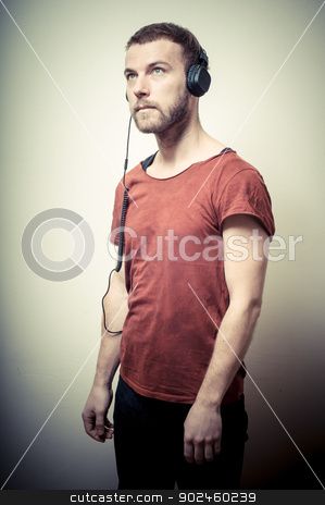 To use this stock image in your creative project, please select the size you need over to the right and click the "Add to Cart" button.
Your downloaded image will come with the Cutcaster watermark removed so don’t worry about the watermark you see on this page. vintage portrait of fashion guy with headphones stock photo, vintage portrait of fashion guy with headphones on gray background by Eugenio Marongiu