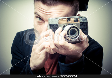 To use this stock image in your creative project, please select the size you need over to the right and click the "Add to Cart" button.
Your downloaded image will come with the Cutcaster watermark removed so don’t worry about the watermark you see on this page. vintage portrait of fashion guy with old camera stock photo, vintage portrait of fashion guy with old camera on gray background by Eugenio Marongiu