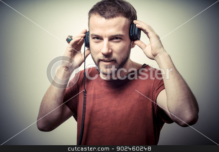 To use this stock image in your creative project, please select the size you need over to the right and click the "Add to Cart" button.
Your downloaded image will come with the Cutcaster watermark removed so don’t worry about the watermark you see on this page. vintage portrait of fashion guy with headphones stock photo, vintage portrait of fashion guy with headphones on gray background by Eugenio Marongiu